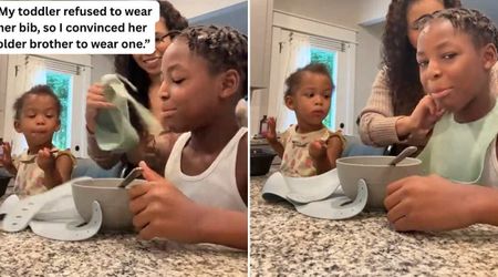 Older brother steps in when toddler refuses to wear her bib — she’s never enjoyed her meal more